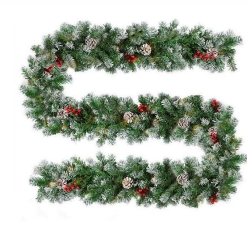 white-sprayed with pine cones and red berries